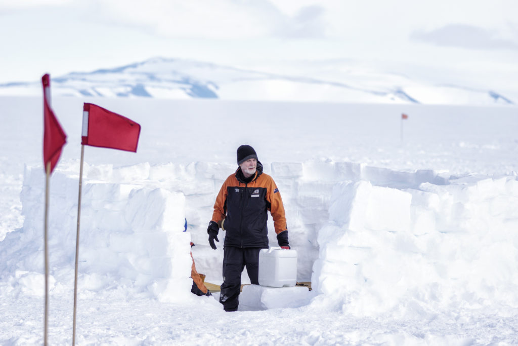 Captain Antarctica Sean McBride on the Ross Ice Shelf building an ice kitchen